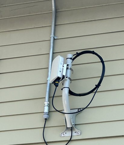 Hanwha camera on green siding